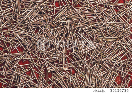 Texture of yellow nails on red background. Texture of yellow nails on red background. 59136756