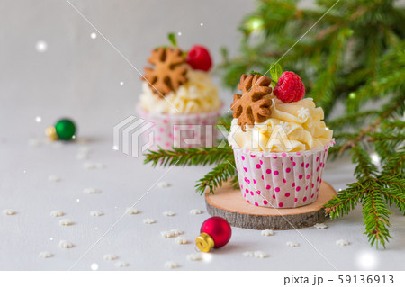 Christmas cupcakes or muffins with cream and Christmas cupcakes or muffins with cream and 59136913