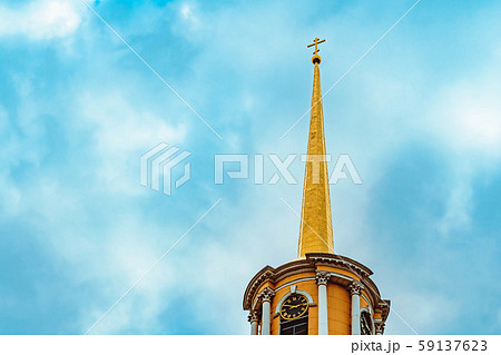 a tall old tower with a spire at the top a tall old tower with a spire at the top 59137623