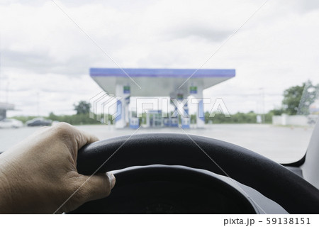 A Driver with Gas fuel station and clouds and blue A Driver with Gas fuel station and clouds and blue 59138151