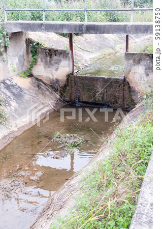 Concrete weir in the irrigation system. Concrete weir in the irrigation system. 59138750