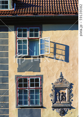Open window on the facade of an old house 59139382