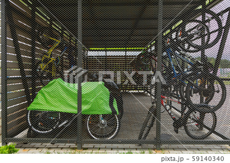 Bicycles parking place with bikes standing and handing Bicycles parking place with bikes standing and handing 59140340