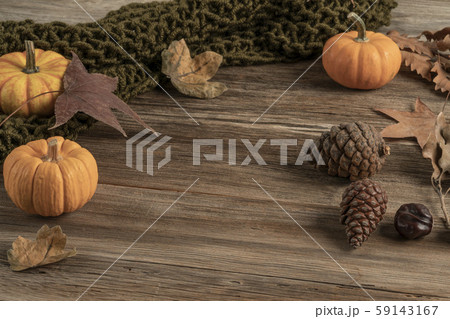 wooden table decorated with pumpkins and dried 59143167