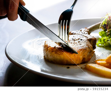 knife cutting grilled pork chops steak Close up, knife cutting grilled pork chops steak Close up, 59155234