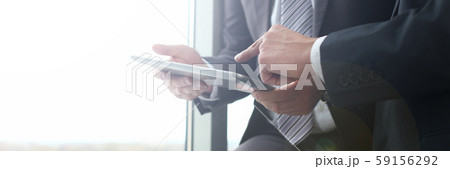 Two businessman are looking and 59156292