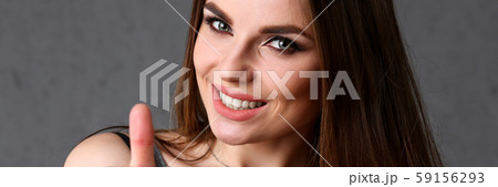 Beautiful young smiling brunette girl show OK Beautiful young smiling brunette girl show OK 59156293