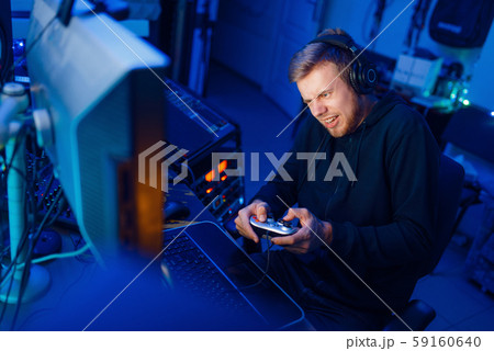 Gamer with joystick playing videogame on PC Gamer with joystick playing videogame on PC 59160640