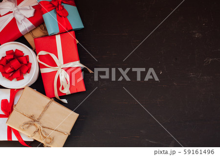 lots of holiday gifts for Christmas birthday on a dark background lots of holiday gifts for Christmas birthday on a dark background 59161496