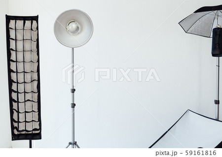 Photo studio equipment flash accessories photographer on a white background Photo studio equipment flash accessories photographer on a white background 59161816