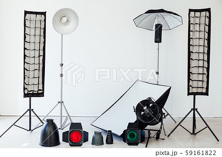 Photo studio equipment flash accessories photographer on a white background Photo studio equipment flash accessories photographer on a white background 59161822