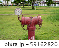 red  fire hydrant sits in a freshly cut grass field. 59162820