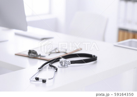 Stethoscope, prescription medical form lying on a table with pc computer. Medicine or pharmacy Stethoscope, prescription medical form lying on a table with pc computer. Medicine or pharmacy 59164350