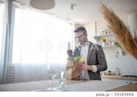 Businessman reading the receipt after going to supermarket 59165608
