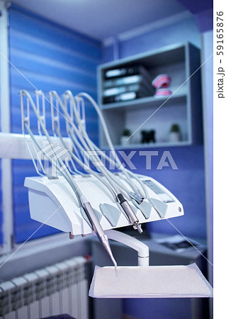 Modern metallic dentist tools and burnishers on a dentist chair Modern metallic dentist tools and burnishers on a dentist chair 59165876