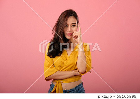 studio portrait of thoughtful asian woman in casual clothing thinking. 59165899