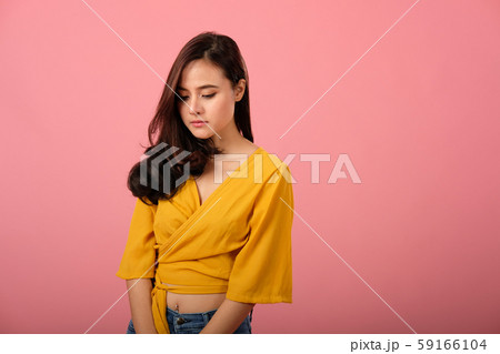 studio portrait of asian woman in casual clothing feeling sad unhappy depressed 59166104