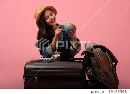 woman backpacker traveler holding globe planning travel destination. journey trip vacation woman backpacker traveler holding globe planning travel destination. journey trip vacation 59166568