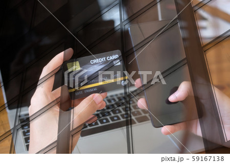 woman holding mobile smart phone & credit card for online shopping 59167138