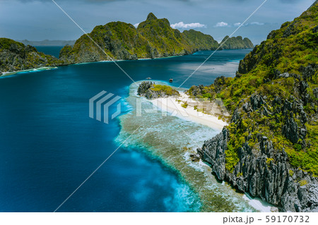 Limestone karst cliffs of Matinloc and Tapuitan Islands and straits between at Palawan, Philippines 59170732