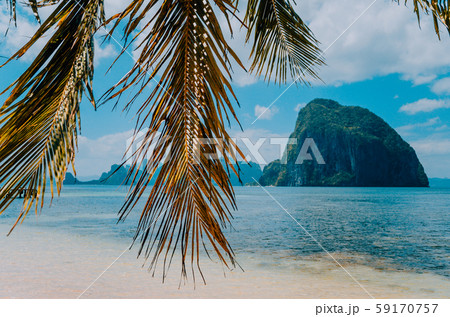 Huge Rock of Pinagbuyutan Island in blue ocean. Landscape of El Nido. Palawan island. Philippines 59170757