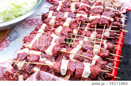 Raw meat on wooden skewers ready for cooking 59171860