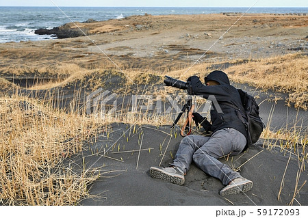Photographer in Iceland, black sand beach 59172093