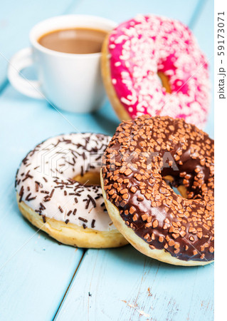 Sweet donuts on black stone table Sweet donuts on black stone table 59173071