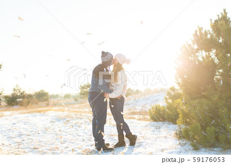 The guy with the girl kiss in the winter in the 59176053