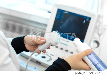 Doctor prepare an ultrasound machine for the 59176439