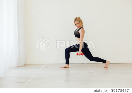 Beautiful blonde woman sports with fitness dumbbells 59178457