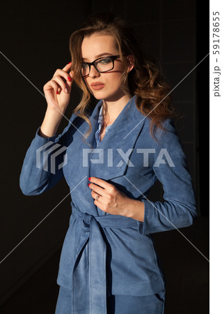portrait of a beautiful business woman in a business suit at work in the office 59178655
