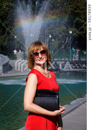 Mature middle-aged woman smiling at the camera on Mature middle-aged woman smiling at the camera on 59178939