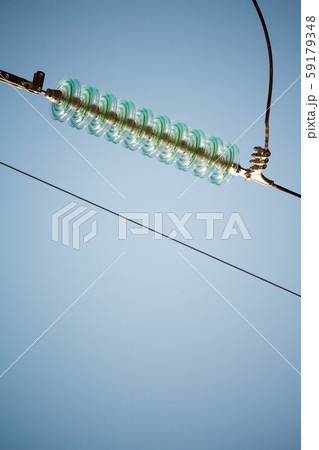 Close-up bottom view of insulators on high-voltage 59179348