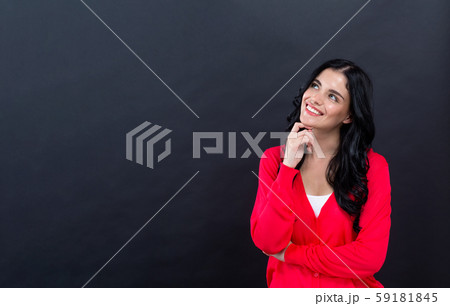 Young woman in a thoughtful pose 59181845