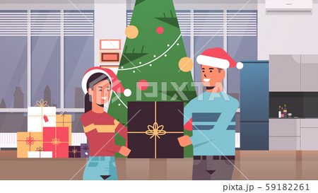 couple holding gift present box merry christmas happy new year holiday celebration concept man woman 59182261