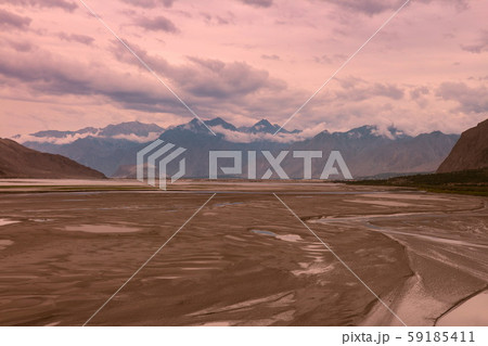 landscape view of the Indus river flowing through Katpana cold desert in Skardu, Gilgit Baltistan, Pakistan. landscape view of the Indus river flowing through Katpana cold desert in Skardu, Gilgit Baltistan, Pakistan. 59185411