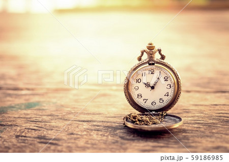 vintage pocket watch on grunge wood log 59186985