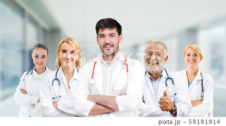 Doctor working in hospital with other doctors. 59191914