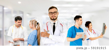 Doctor working in hospital with other doctors. Doctor working in hospital with other doctors. 59191915