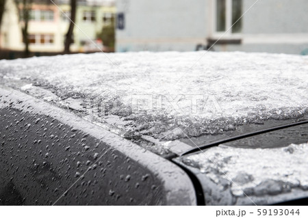 Melting snow and ice on the car roof Melting snow and ice on the car roof 59193044
