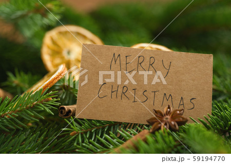 merry christmas card on spruce twigs with decorations merry christmas card on spruce twigs with decorations 59194770