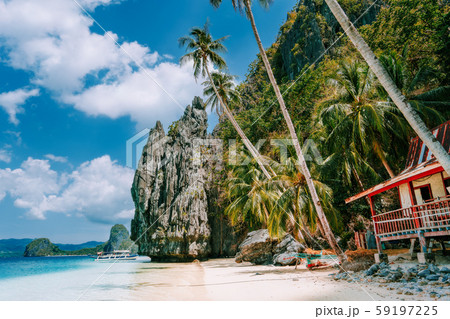 Philippines scenic, Palawan - El Nido island hopping tour view of karst Pinagbuyutan Island, cliffs Philippines scenic, Palawan - El Nido island hopping tour view of karst Pinagbuyutan Island, cliffs 59197225