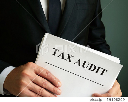 Auditor is holding Tax audit report. 59198209