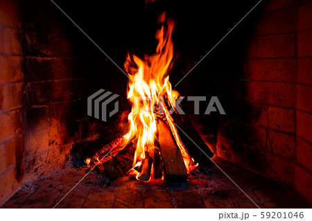 Burning and glowing pieces of wood in Fireplace Burning and glowing pieces of wood in Fireplace 59201046