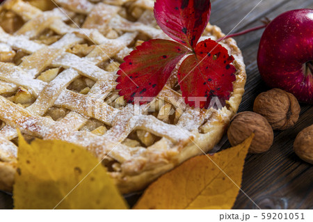 Homemade American Apple Pie Decorated with fresh apples and autumn leaves Homemade American Apple Pie Decorated with fresh apples and autumn leaves 59201051