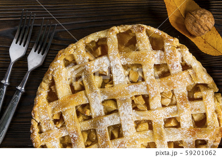 Homemade American Apple Pie Decorated with fresh apples and autumn leaves Homemade American Apple Pie Decorated with fresh apples and autumn leaves 59201062