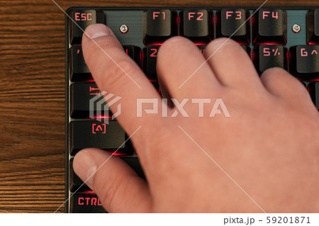 finger on keyboard presses escape 59201871