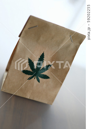 Bag of kraft brown paper with the marijuana logo Bag of kraft brown paper with the marijuana logo 59202255