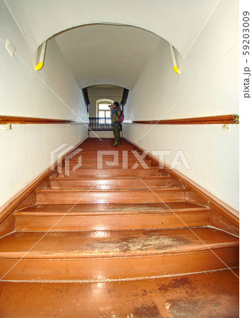 Wooden stairs with handrail in attic in a 59203009